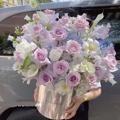 mixed flowers in bucket